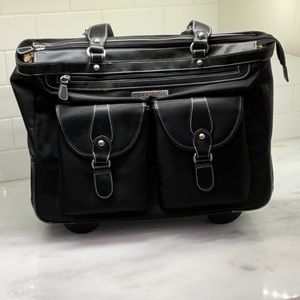 Heavy canvas and leather rolling satchel bag